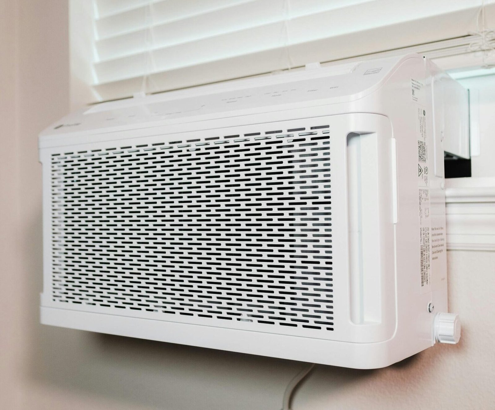 Wall-mounted air conditioner installed in a residential setting, providing cooling comfort.